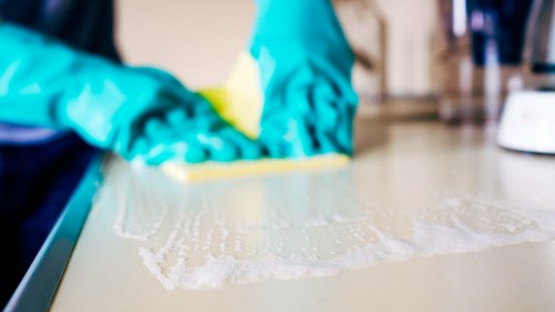 Close-up view of different rug fibers and textures during rug cleaning